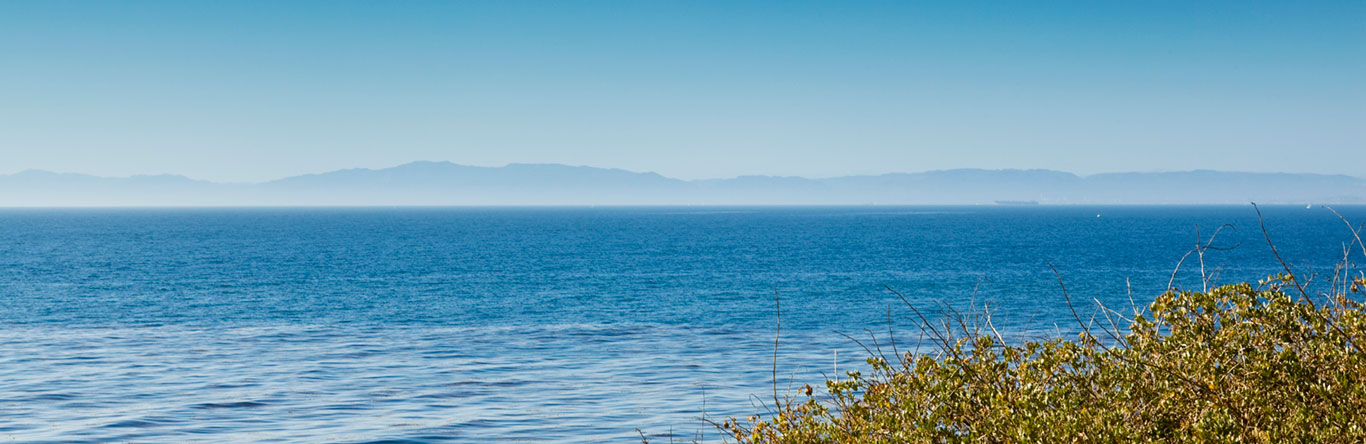 mountains in the distance beyond lake